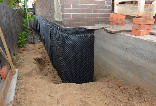 Happy homeowners after waterproofing job in Glenmoore